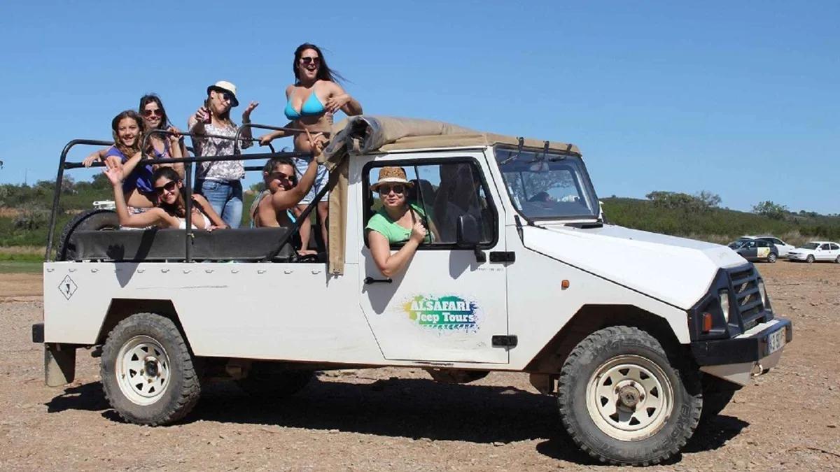 Open 4WD jeep on a dirt track through cork oak country inland from Albufeira on a half-day safari, one of the inland things to do in Albufeira, Algarve